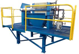 Automatic filter press built on a catwalk with sludge disposal chute.